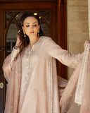 Woman wearing rose beige raw silk suit holding embroidered organza dupatta ends outstretched