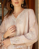 Close-up of hand-embellished neckline and sleeve embroidery on rose beige Korean raw silk shirt