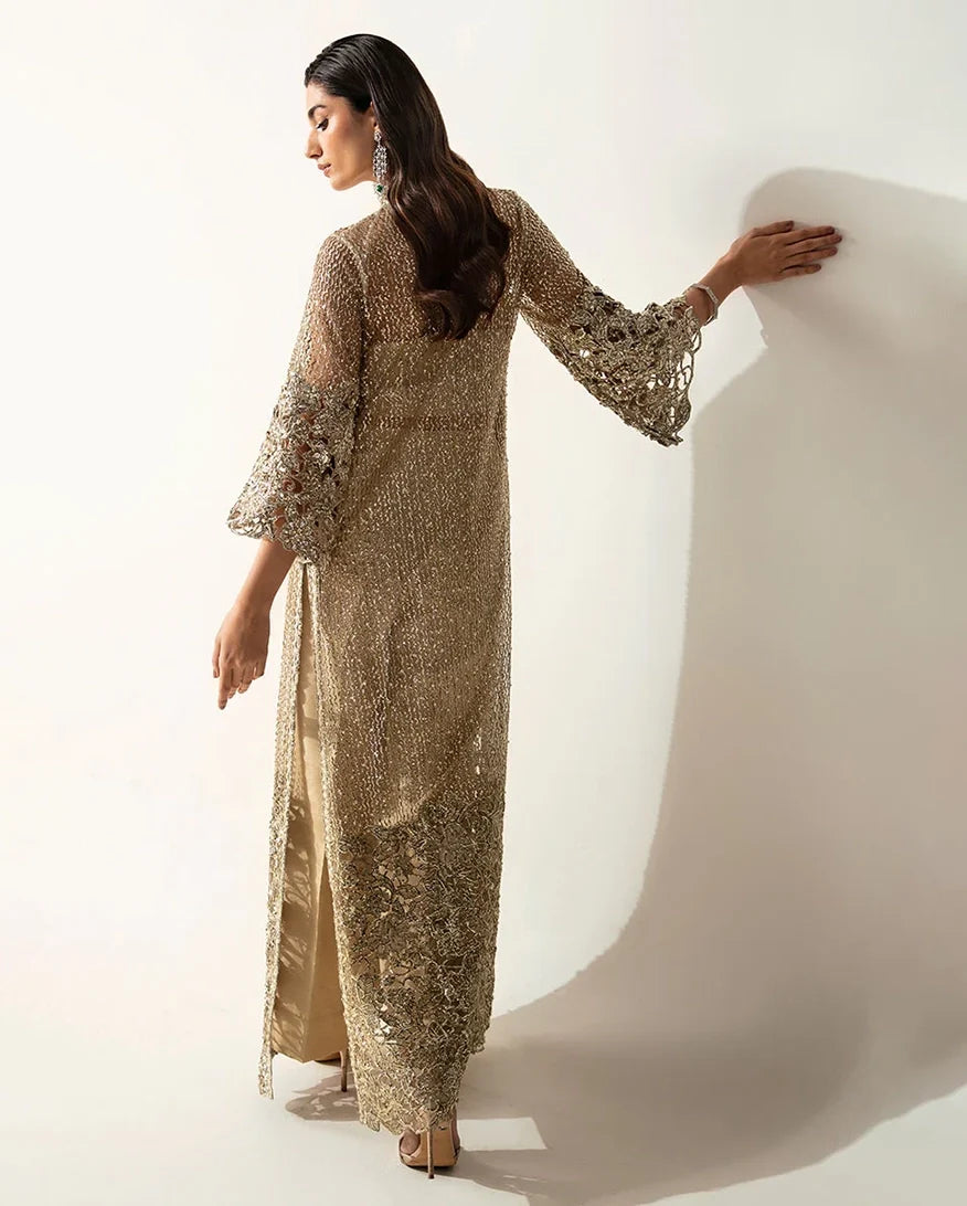 Back view of a Pale Gold Net suit showing the crystal and pearl embellished silhouette