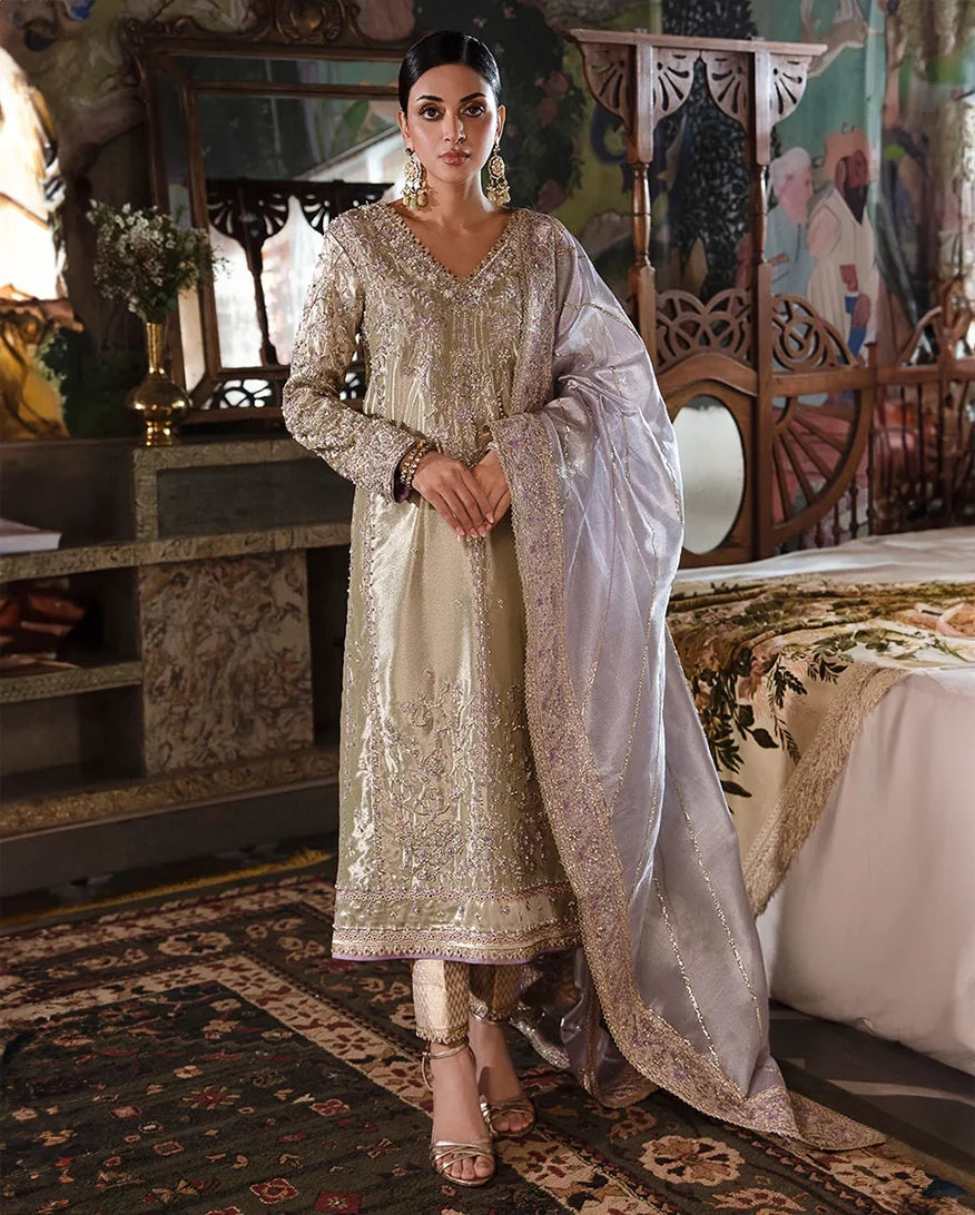 Woman wearing Mint Green Silver Zarri Silk suit with beadwork and threadwork