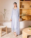 Woman wearing a light blue luxury pret suit with silver embroidery, Zarminay collection
