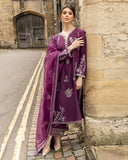 Woman wearing a Purple embroidered Raw Silk suit with resham and crystal embellishment