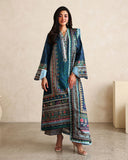 Woman wearing blue printed raw silk suit with striped trouser and teal dupatta