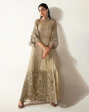 Woman wearing a Pale Gold Net suit embellished with crystals, pearls, and Swarovski elements