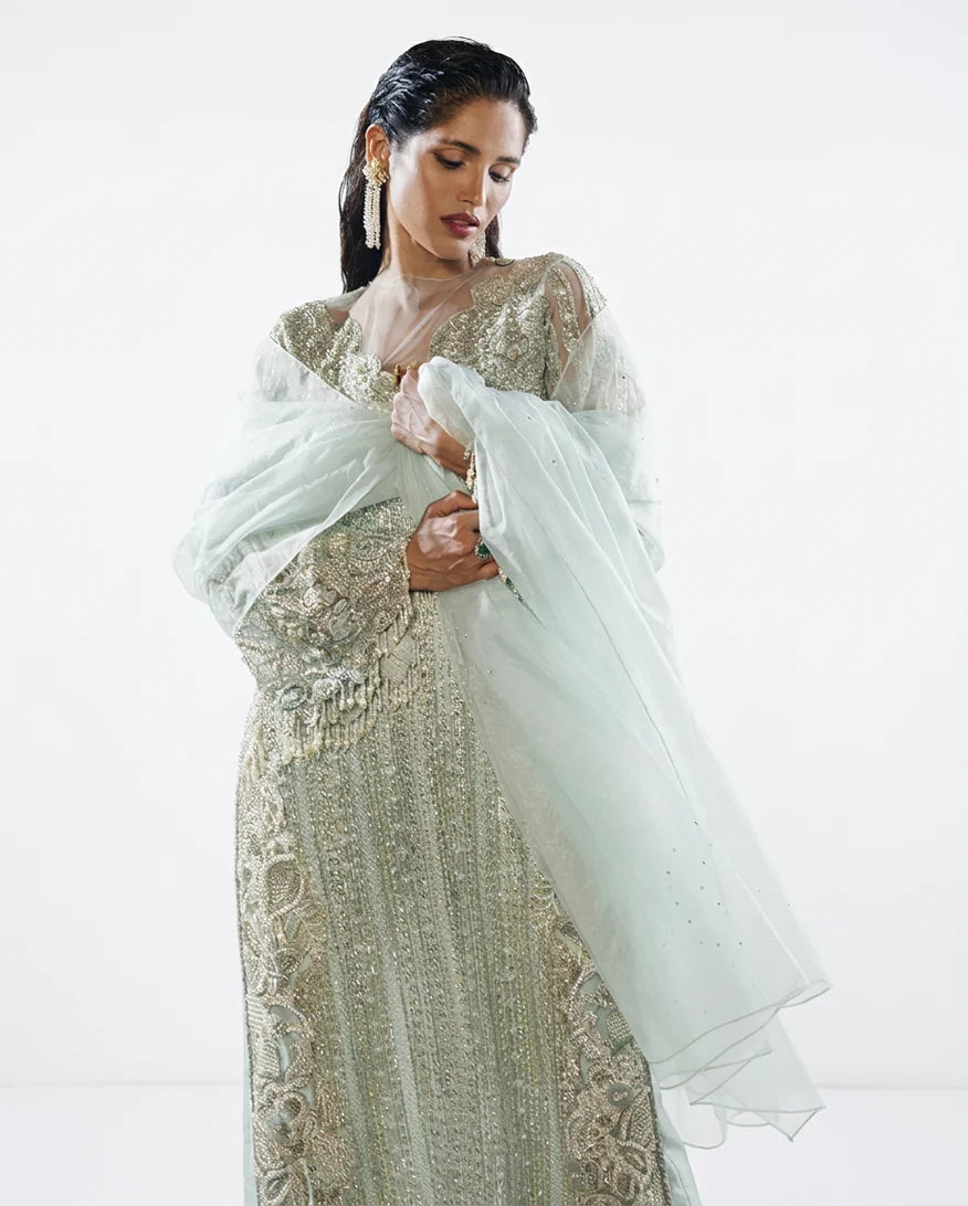 Close-up portrait in an Aqua Net suit with a diaphanous organza dupatta
