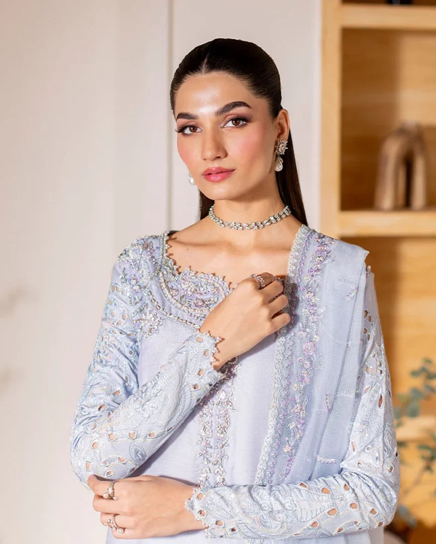 Portrait shot of light blue luxury pret suit with embroidered neckline, Zarminay collection