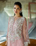 Close-up of embroidered bodice detailing on a Powder Pink Net suit