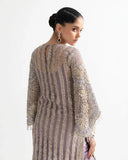 Back view of a Lilac Net suit showing dabka-embroidered panel detailing