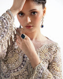 Close-up of pearl-fringed sleeve cuff on a Lilac Net suit
