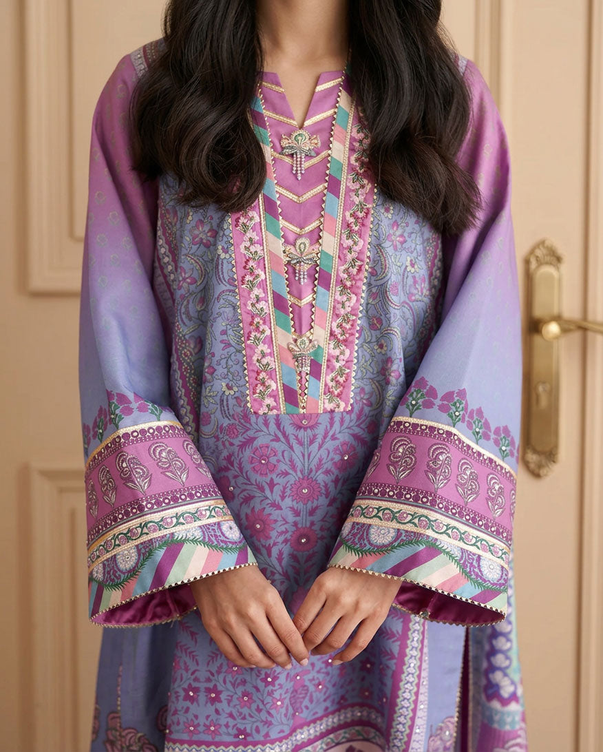Close-up of printed sleeve cuffs and embroidered neckline on purple raw silk shirt