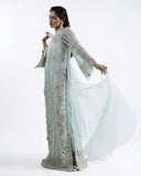 Woman wearing an Aqua Net suit, the organza dupatta caught mid-flow