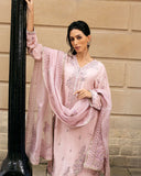 Woman wearing Astrid pink raw silk suit with resham embroidery and cutwork lace border dupatta