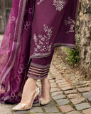 Close-up of the embroidered organza-bordered hem on a Purple Raw Silk suit
