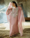Woman wearing a Powder Pink Net suit with a flowing organza dupatta