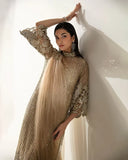 Styled portrait in a Pale Gold Net suit with a dramatically draped, crystal-embellished sleeve
