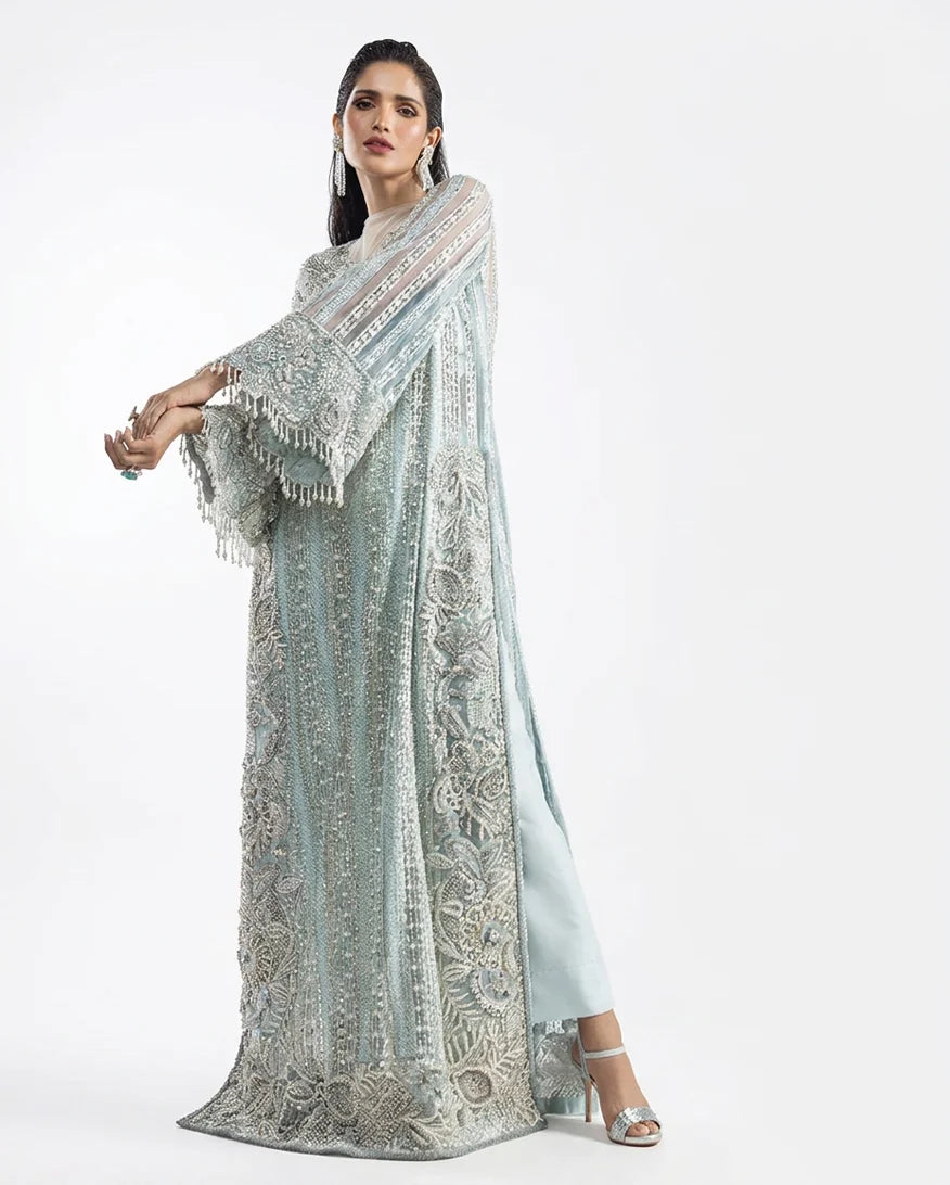 Side profile of an Aqua Net suit with an embellished organza dupatta draped over the shoulder