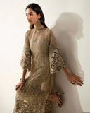 Woman wearing a Pale Gold Net suit, highlighting the sheer sleeve's crystal and pearl detailing