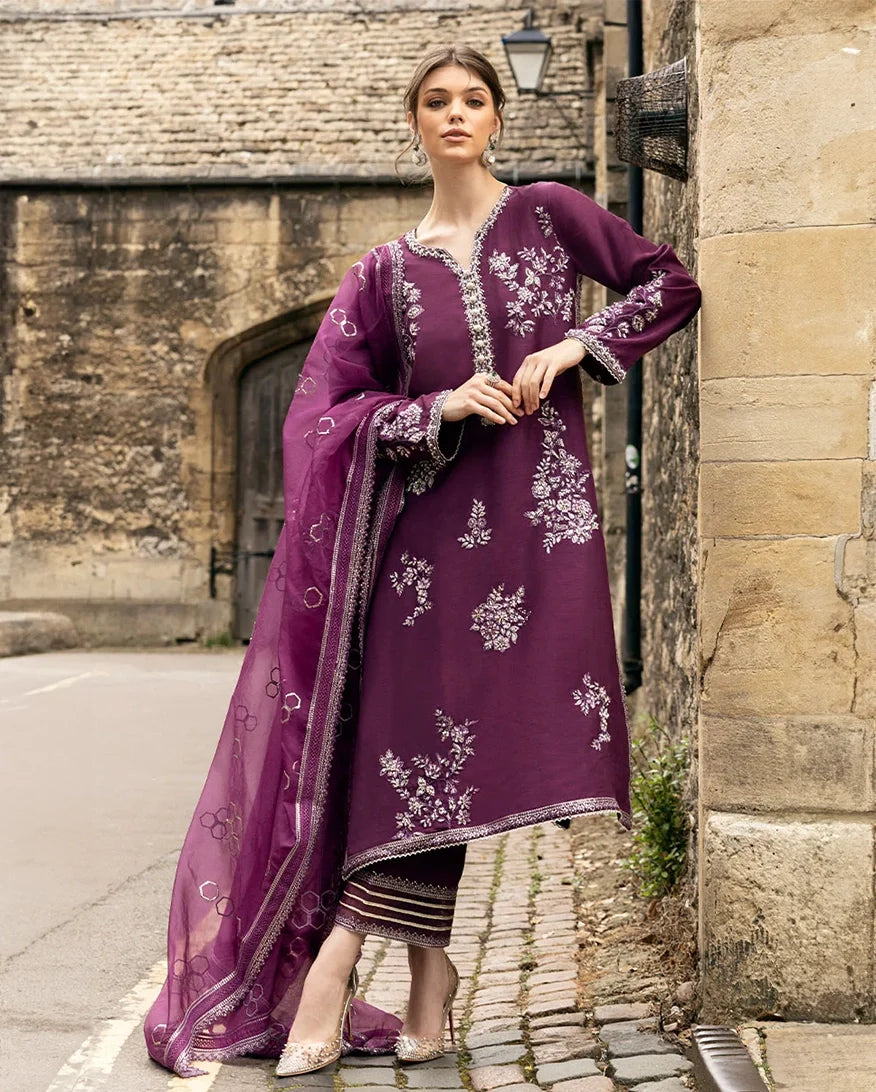 Woman wearing a Purple embroidered Raw Silk suit with resham and crystal embellishment
