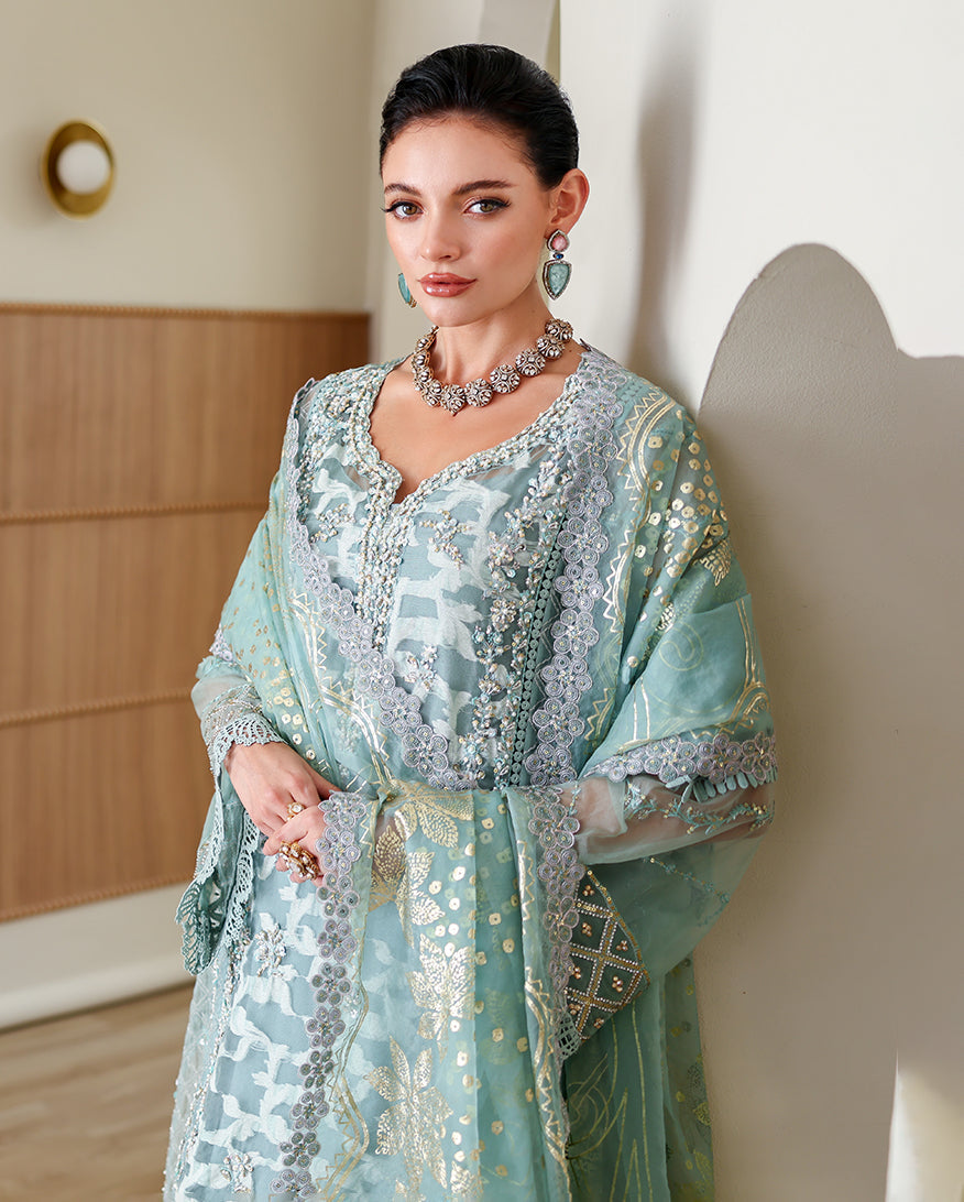 Woman wearing embroidered Aqua Green Organza kurta with sequin dupatta, part of Mushq's luxury pret Pakistan Espoir collection