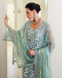 Woman in Aqua Green Organza pret suit, sequin-embellished dupatta draped over arm, Espoir by Mushq