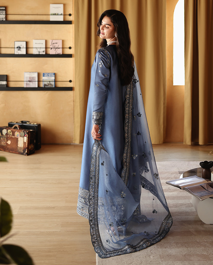 Side view of blue luxury pret suit with embroidered border, Zarminay collection