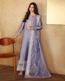 Woman wearing a lavender-gray luxury pret suit with silver mirror-work embroidery from the Zarminay collection
