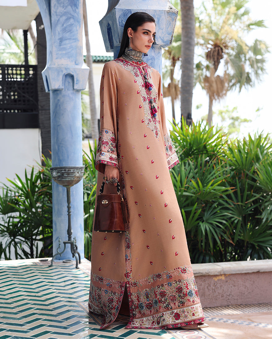 Side view of peach raw silk dress showing embroidered sequinned silk border at the hemline