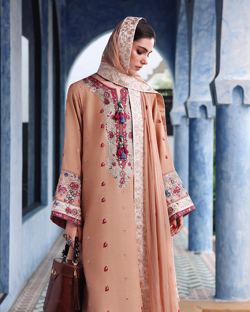 Front view of peach raw silk dress showing embroidered sequinned silk sleeve border