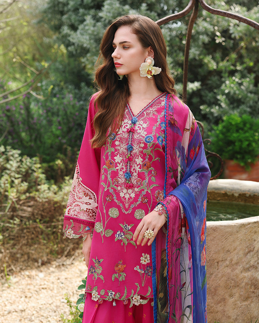 Woman wearing fuchsia lawn unstitched collection suit with floral earrings and blue printed dupatta, Secret Garden collection