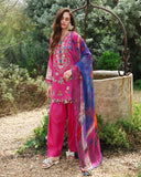 Woman wearing fuchsia unstitched lawn suit near stone well, floral embroidery and printed dupatta, Secret Garden collection