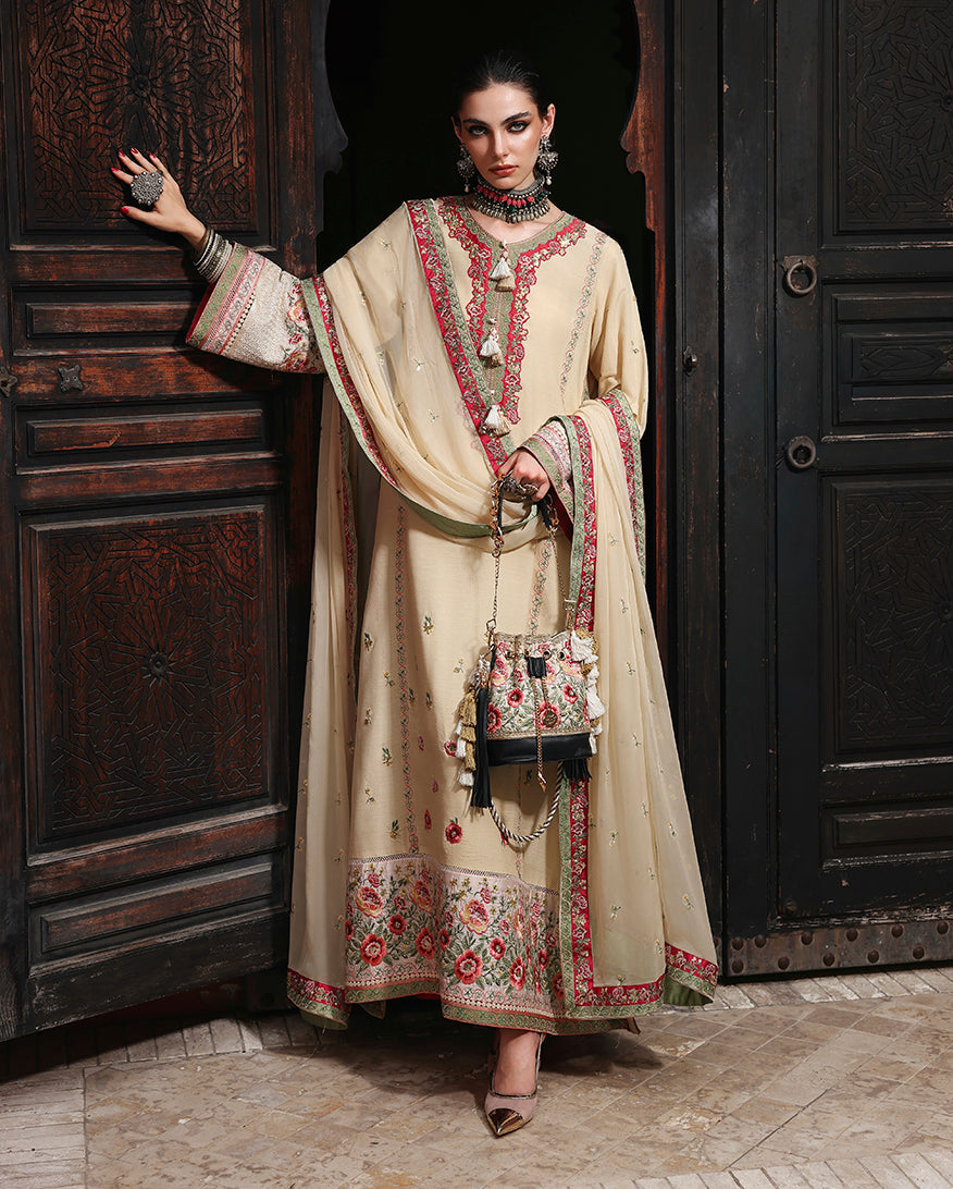 Woman wearing off white raw silk dress with double-border embroidered chiffon dupatta