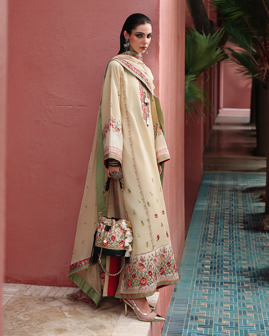 Side view of off white raw silk dress showing embroidered silk dupatta border