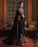 Side view of black raw silk suit showing sequinned sleeve border and embroidered chiffon dupatta
