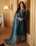 Woman wearing a teal blue luxury pret suit with silver embroidery, Zarminay collection