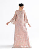 Woman wearing peach embroidered net kaftan with fringed bell sleeves