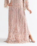 Close up of Woman wearing peach net kaftan with sheer dupatta draped and flowing behind