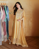 Full-length front view of golden yellow luxury pret suit with embroidered hem, Zarminay collection