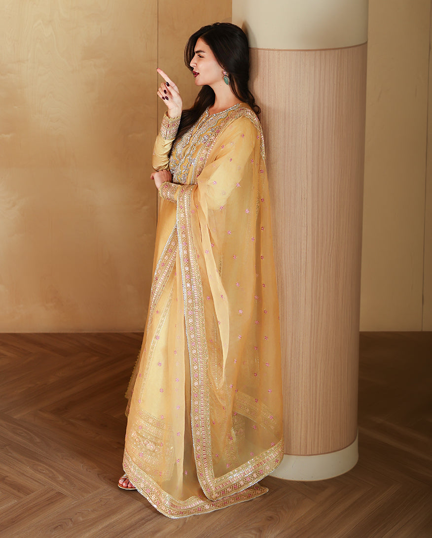 Side view of golden yellow luxury pret suit with embroidered dupatta, Zarminay collection