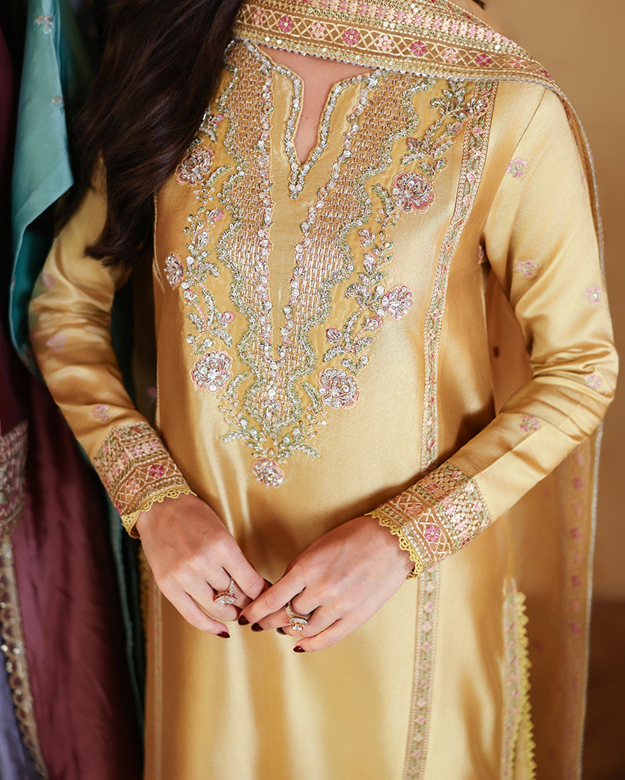 Close-up of neckline and cuff embroidery on golden yellow luxury pret suit, Zarminay collection