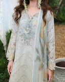 Woman wearing lemon yellow lawn unstitched collection suit with eyelet lace embroidery, Secret Garden collection