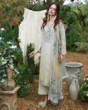 Woman wearing lemon yellow unstitched lawn suits with scalloped lace embroidery, standing near garden urns, Secret Garden collection