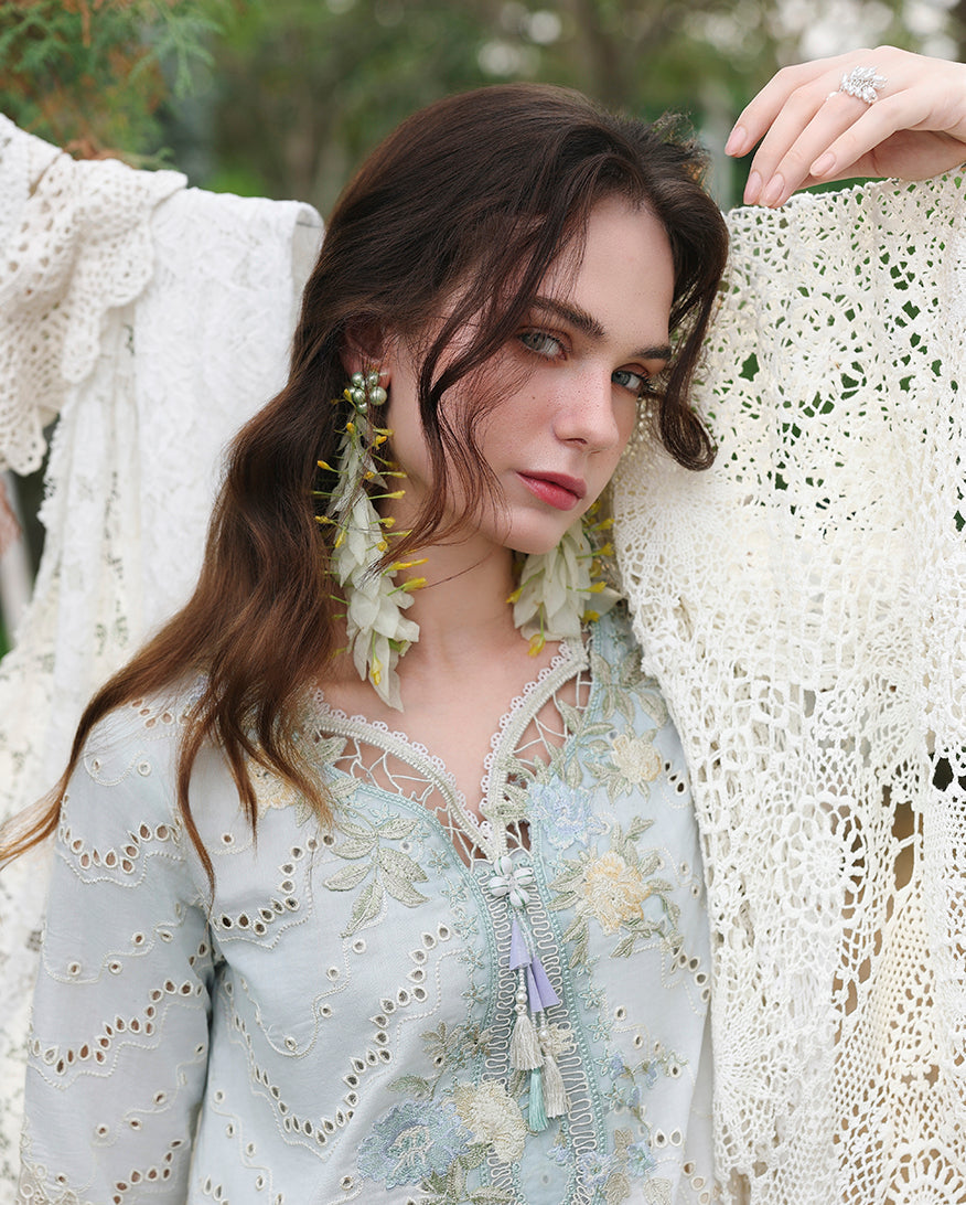 Woman wearing lemon yellow embroidered lawn collection top holding cream lace shawl, Secret Garden collection