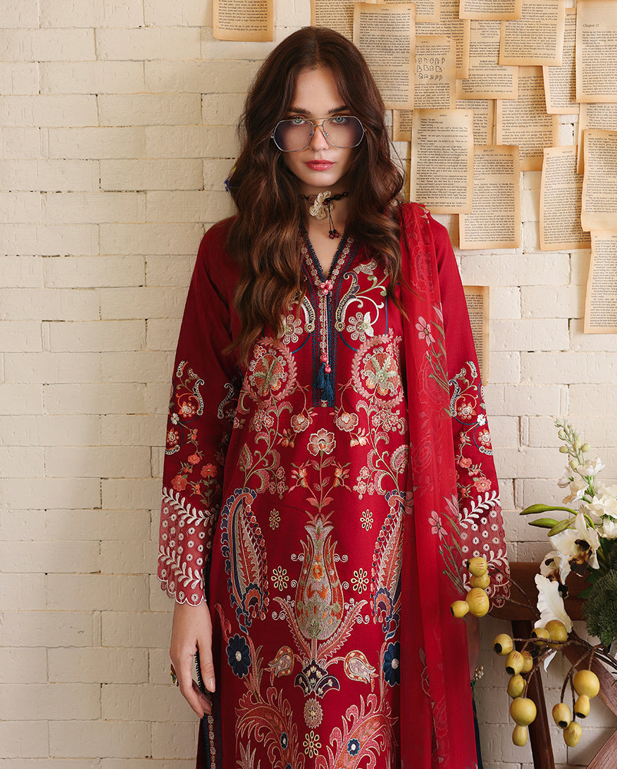 Woman wearing glasses and red embroidered lawn collection suit with paisley embroidery, Secret Garden collection
