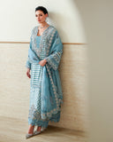 Woman wearing Blue self-patterned brosha suit with organza dupatta