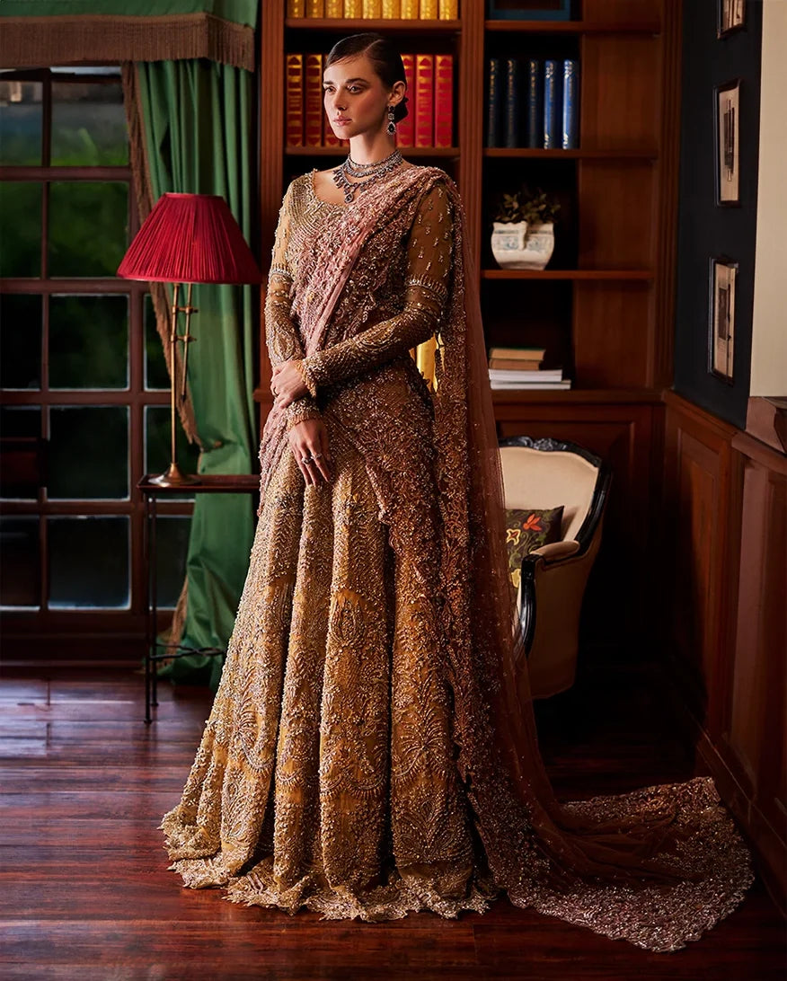 Olive gold bridal lehenga with blush dupatta draped over the shoulder and arm, front view