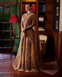 Olive gold bridal lehenga with blush dupatta draped over the shoulder and arm, front view