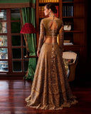 Back view of olive gold bridal lehenga showing keyhole blouse back and beaded tassel trim