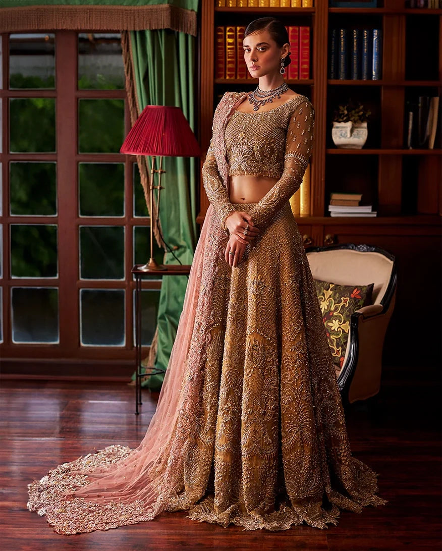 Olive gold embellished bridal lehenga with sheer sleeves and blush dupatta draped to one side, front view