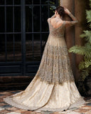 Woman in Beige Net bridal wear, back view with pendant necklace and train