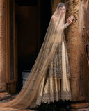 Woman in a Beige Net bridal dress and veil, one of Mushq's pakistani wedding dresse